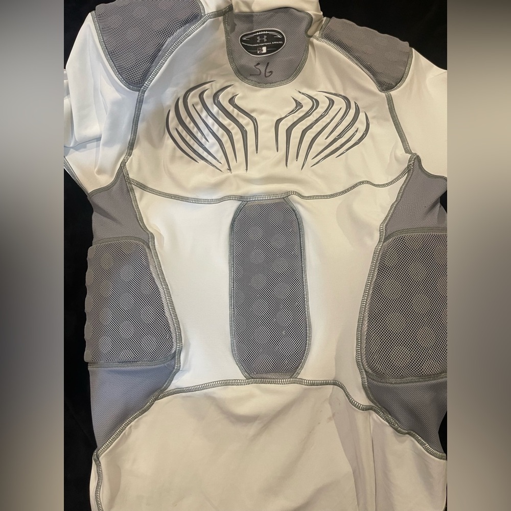 UA compression shirt . wear under your football shoulder pads.